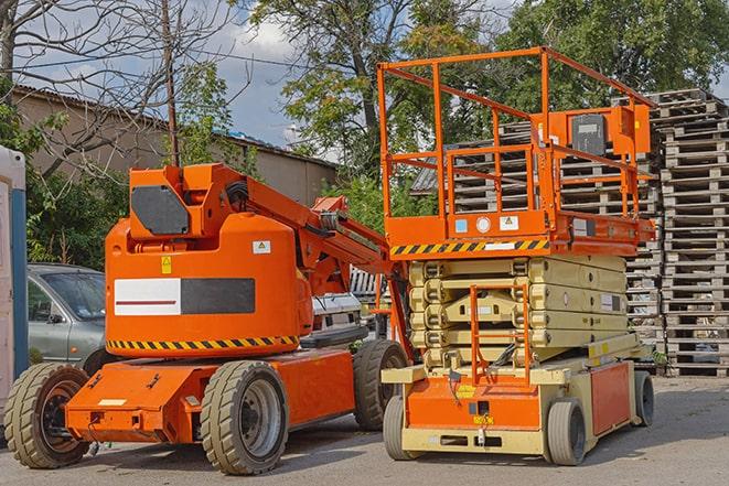 forklift carrying pallets in warehouse in Carrollton, TX